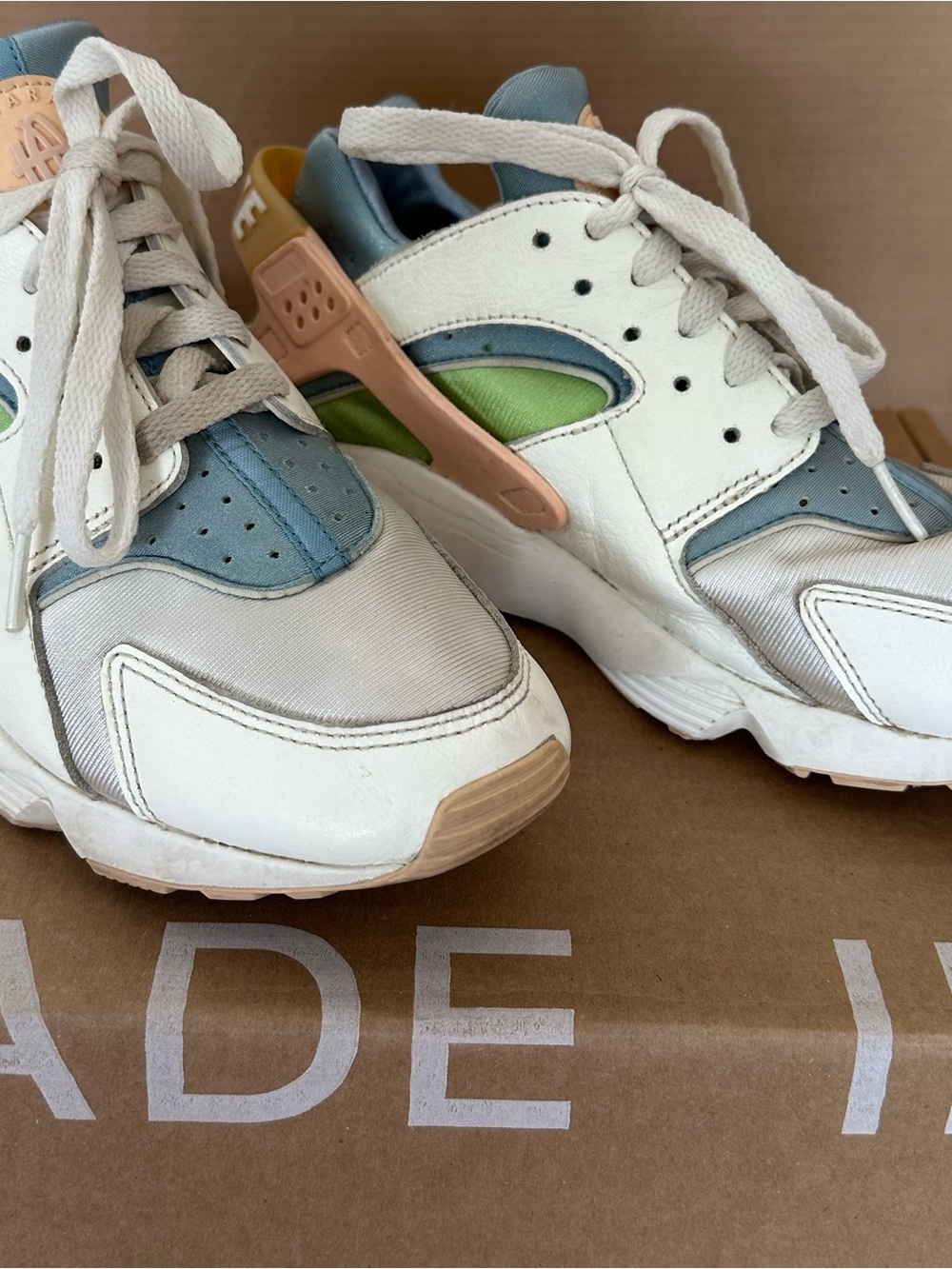 Nike Kids White Sneakers with Blue, Green & Peach Accents